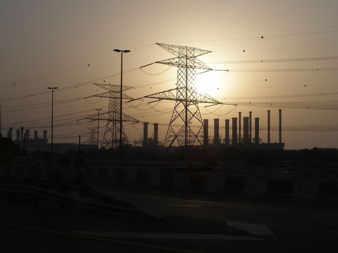 Power lines and a power station at sunset on the road from Dubai to Abu Dhabi